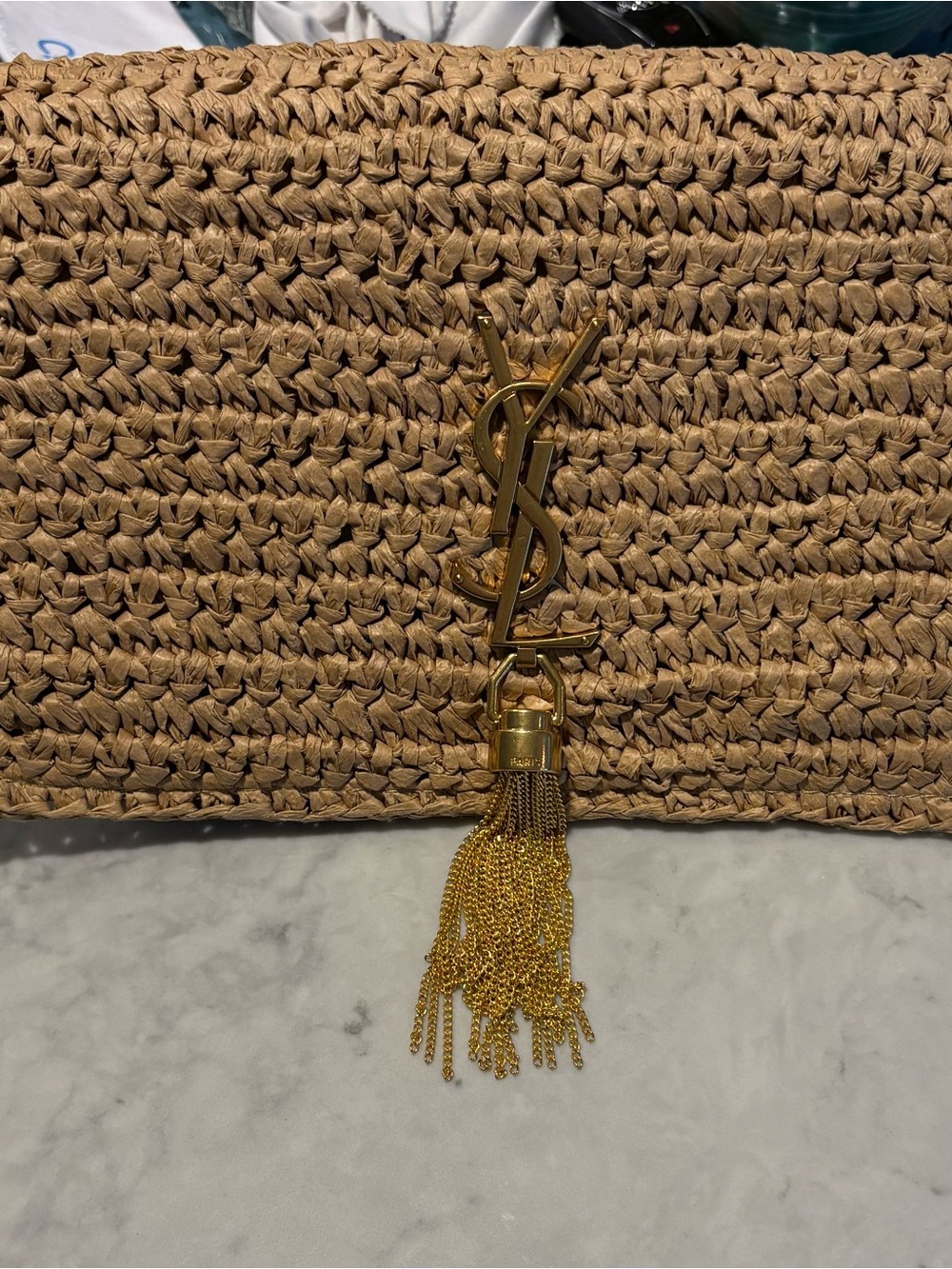 Woven Straw Clutch with Gold logo and Gold Tassel